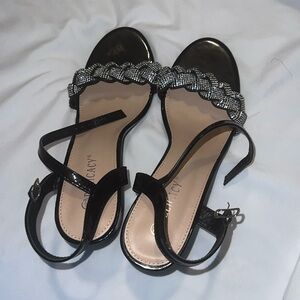 Heels . Bought these in a store . Wore only once black and silver